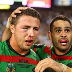 English international representative Sam Burgess, looking worse for wear with a busted cheekbone and eye socket, is congratulated for his efforts by team mate and Australian international representative Greg Inglis (GI)